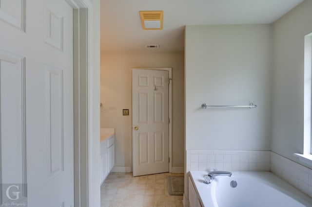 bathroom with vanity and a bathing tub