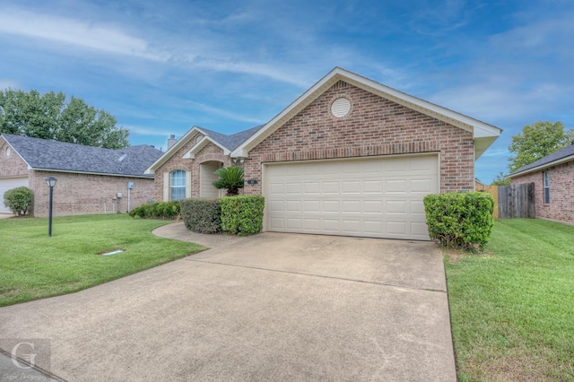 ranch-style home with a front lawn and a garage