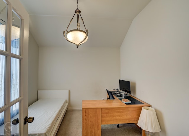 bedroom with carpet floors and vaulted ceiling