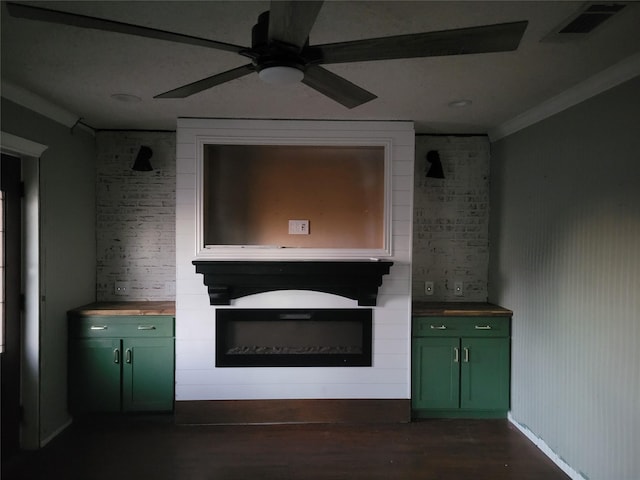 interior space with ceiling fan and a fireplace