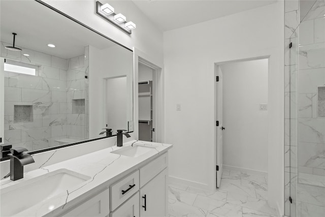 bathroom featuring vanity and tiled shower