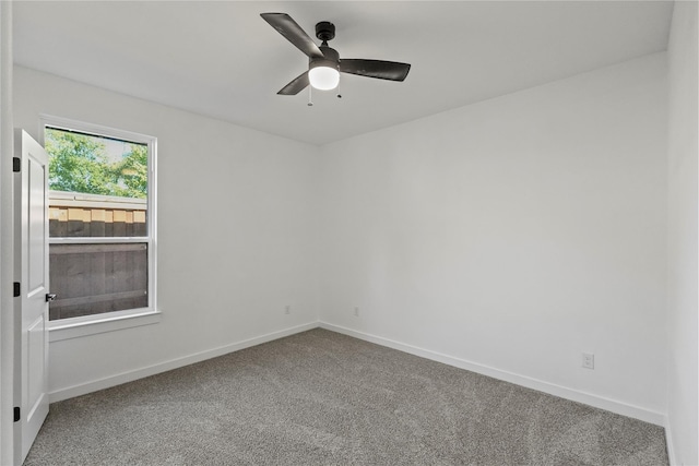 carpeted empty room with ceiling fan