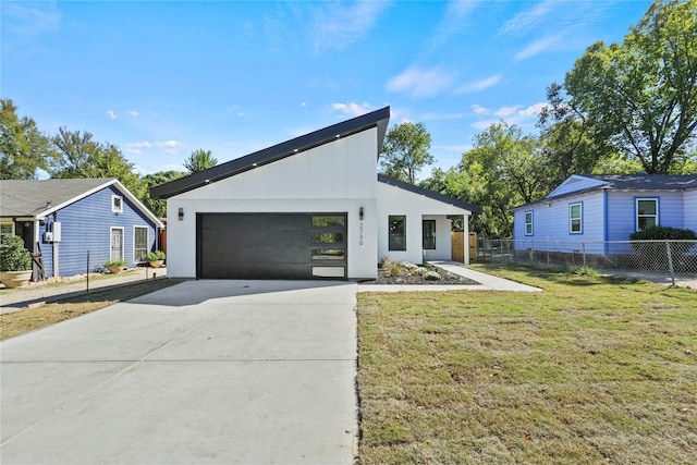 view of front facade featuring a garage and a front lawn