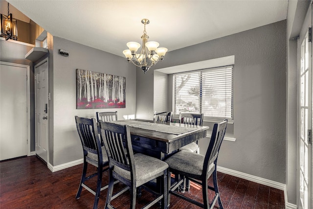 dining area featuring a notable chandelier and dark hardwood / wood-style floors