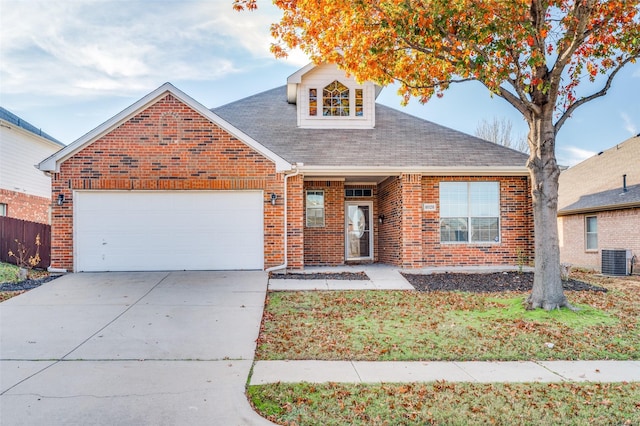 view of front of house featuring a garage and central AC unit