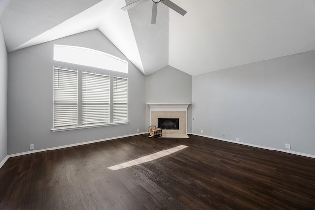 unfurnished living room with ceiling fan, a fireplace, hardwood / wood-style floors, and lofted ceiling