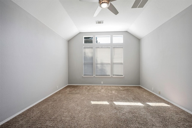 additional living space featuring carpet, ceiling fan, and vaulted ceiling