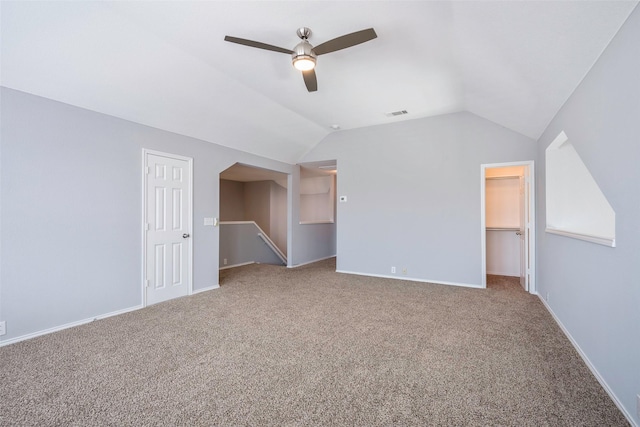 additional living space with carpet flooring, ceiling fan, and lofted ceiling