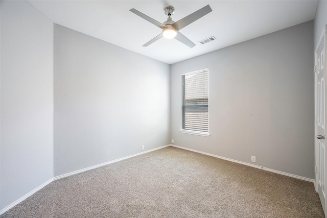 carpeted empty room featuring ceiling fan