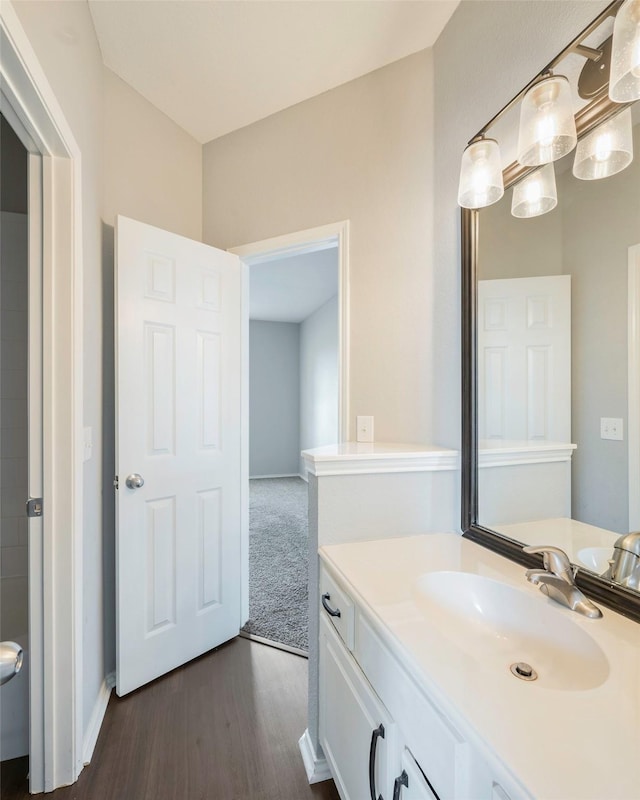 bathroom featuring hardwood / wood-style flooring and vanity