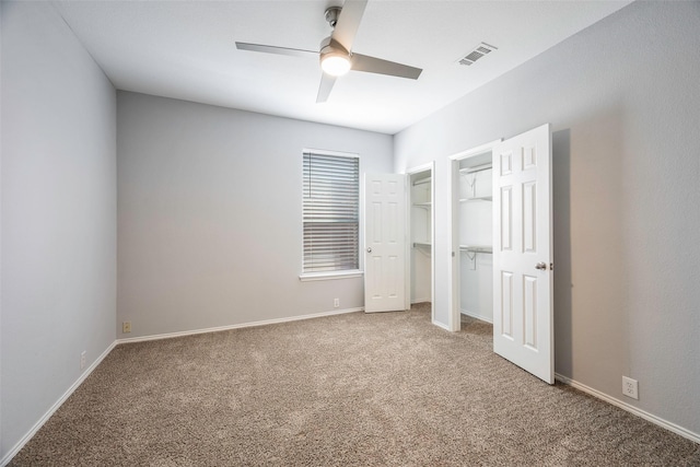 unfurnished bedroom with ceiling fan and carpet floors