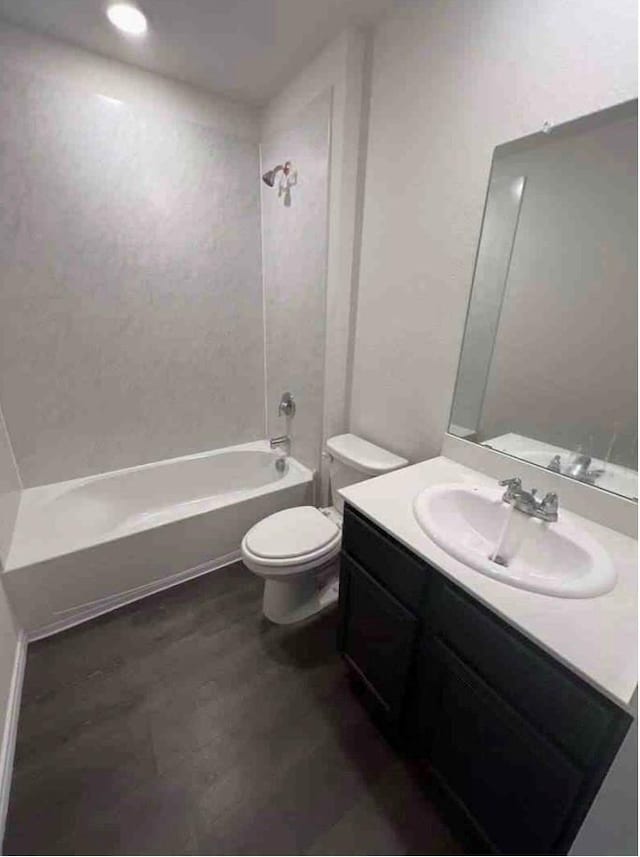 full bathroom featuring vanity, shower / tub combination, and toilet