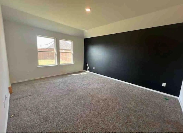 spare room featuring carpet