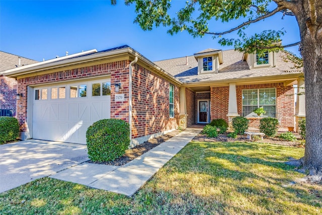 view of front of house with a garage and a front lawn