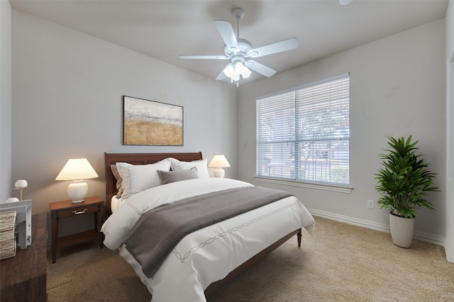 bedroom featuring ceiling fan and light colored carpet