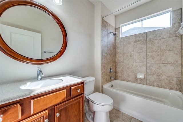 full bathroom with tile patterned flooring, vanity, toilet, and tiled shower / bath