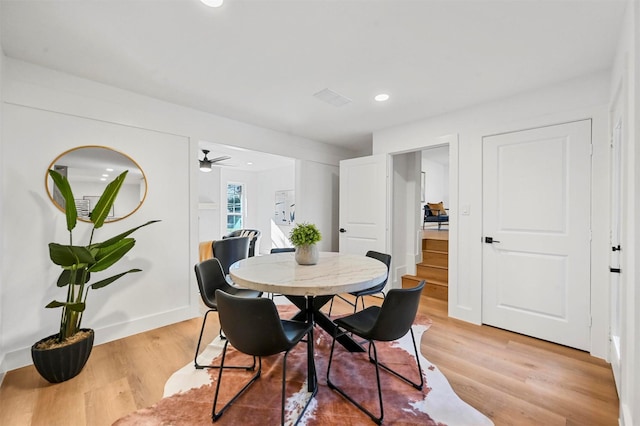 dining space featuring ceiling fan and light hardwood / wood-style flooring