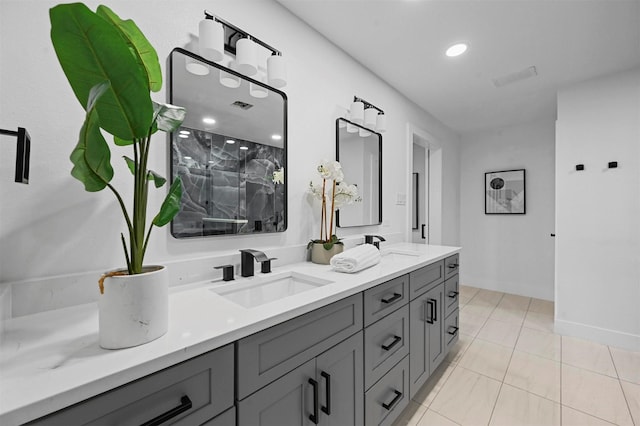 bathroom with tile patterned floors, vanity, and walk in shower