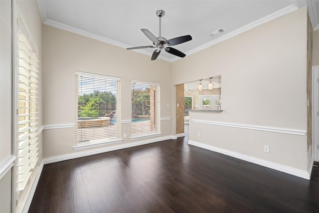 spare room with crown molding, dark wood-type flooring, and ceiling fan