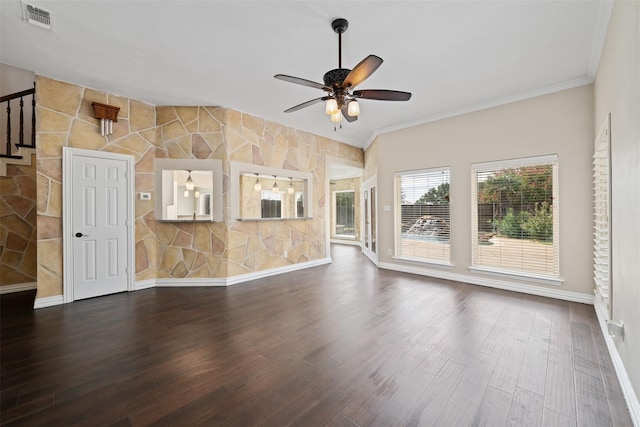 unfurnished living room with hardwood / wood-style flooring, ornamental molding, and ceiling fan