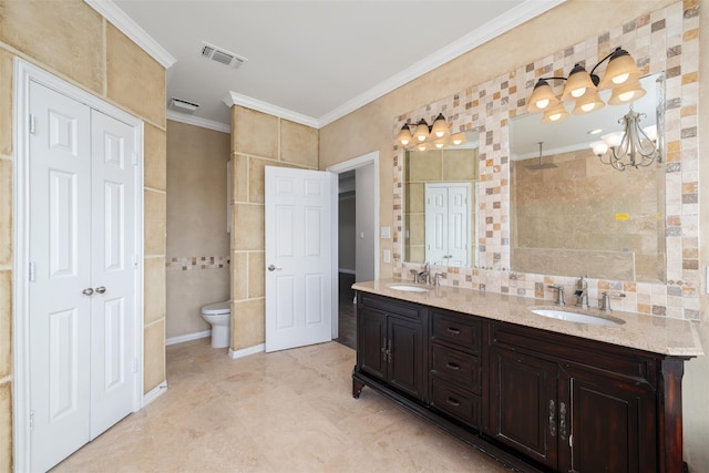 bathroom featuring tile walls, vanity, a notable chandelier, ornamental molding, and toilet