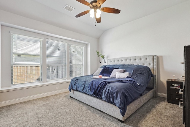 bedroom with carpet flooring, vaulted ceiling, and ceiling fan