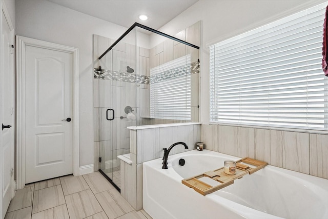 bathroom with plenty of natural light and plus walk in shower