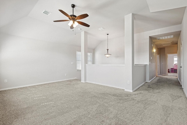 unfurnished living room with ceiling fan, lofted ceiling, and carpet flooring