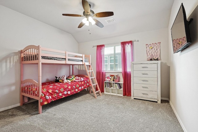 carpeted bedroom with vaulted ceiling and ceiling fan