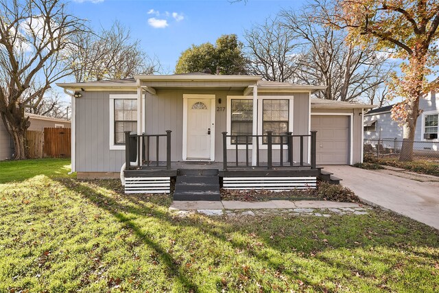 view of front facade with a front yard and a garage