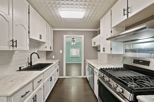 kitchen featuring white cabinetry, ceiling fan, stainless steel appliances, and sink