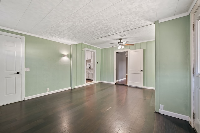 interior space featuring dark hardwood / wood-style floors, ceiling fan, crown molding, and sink