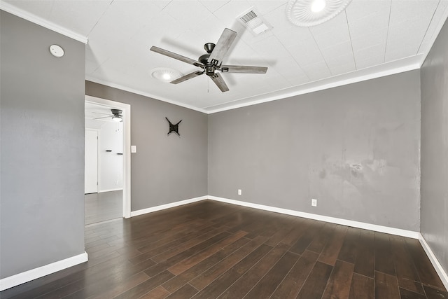 spare room featuring crown molding, ceiling fan, and dark wood-type flooring