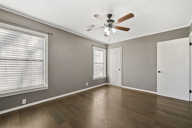 unfurnished room with a textured ceiling, dark hardwood / wood-style flooring, and ceiling fan