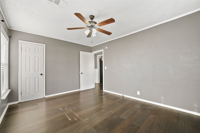 unfurnished bedroom with a textured ceiling, dark hardwood / wood-style floors, ceiling fan, and crown molding