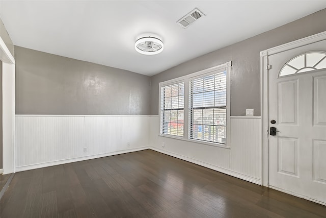 foyer entrance with dark hardwood / wood-style flooring