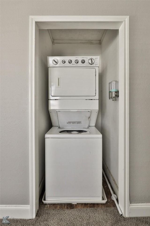 laundry room featuring stacked washer and clothes dryer