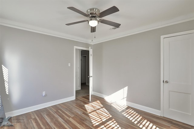 unfurnished bedroom featuring ceiling fan, light wood-type flooring, and ornamental molding