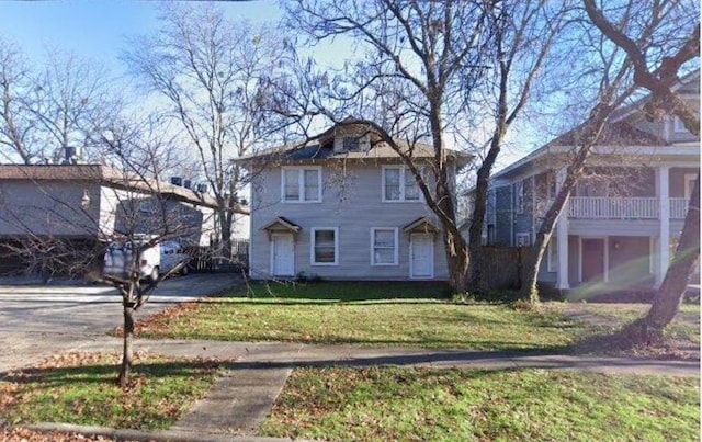 front facade with a front lawn