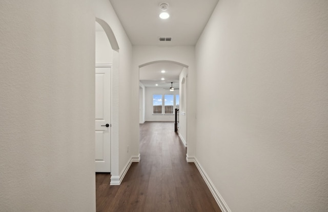 hallway featuring dark wood-type flooring