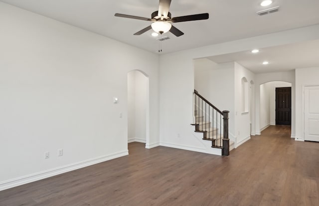 spare room featuring ceiling fan and dark hardwood / wood-style floors