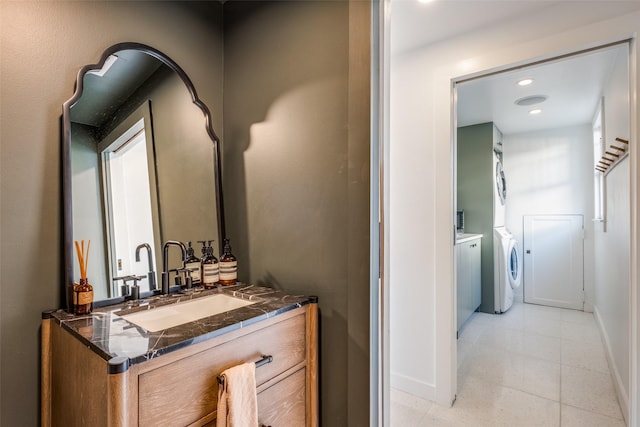 bathroom with washer / clothes dryer and vanity