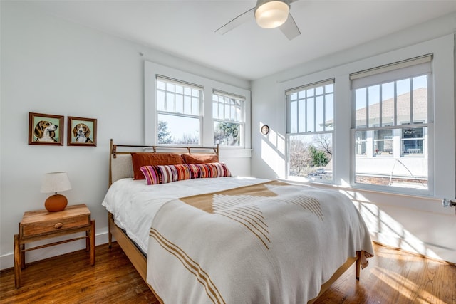 bedroom featuring dark hardwood / wood-style floors and ceiling fan