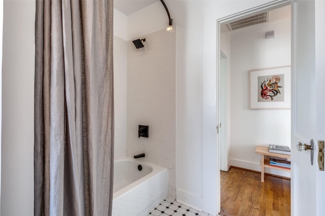 bathroom featuring shower / bath combination with curtain and wood-type flooring