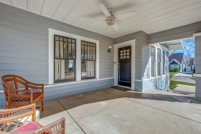 view of exterior entry featuring a patio and ceiling fan