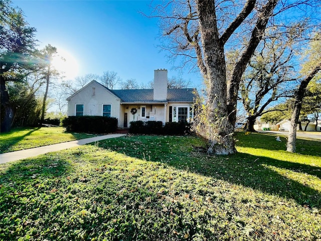 ranch-style house with a front lawn