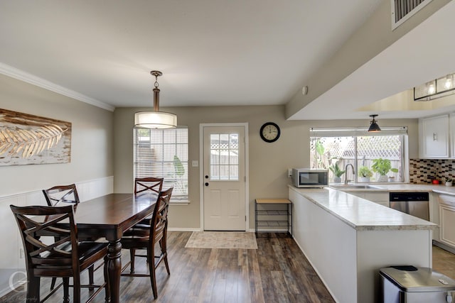 dining area featuring dark hardwood / wood-style floors and sink