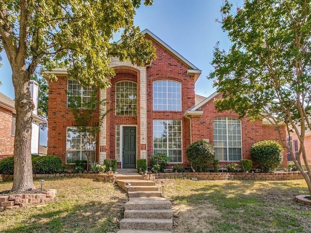 view of property with a front lawn