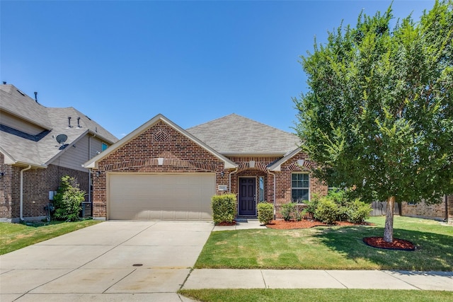 view of front of house with a front yard and a garage