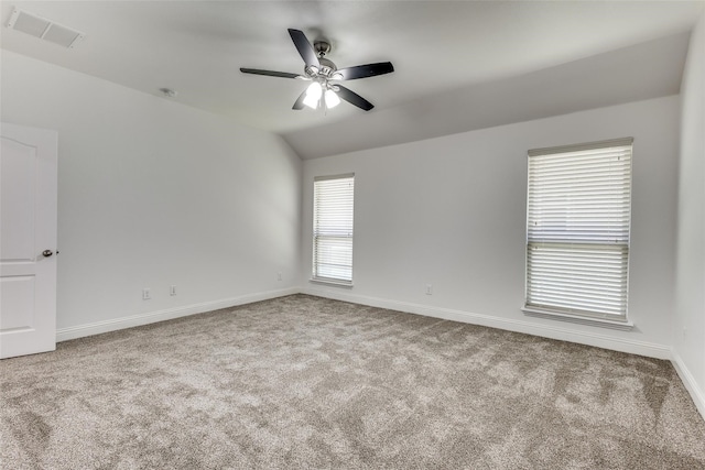 unfurnished room with ceiling fan, light carpet, and vaulted ceiling